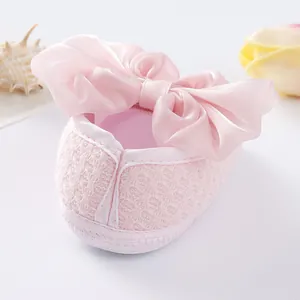 Pink baby girl soft sole princess shoes with large satin bow and lace texture