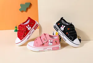 Cute kids canvas shoes with rabbit patterns in red, pink, and black colors