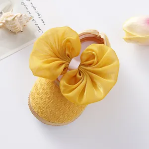 Yellow newborn baby girl princess shoes with large mesh bow and soft sole