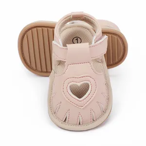 Pink baby summer sandals featuring a decorative heart cutout and soft non-slip sole