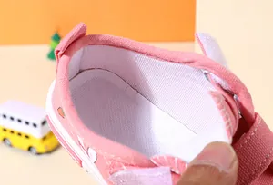 Close-up of pink children's canvas shoe interior lining and comfortable insole
