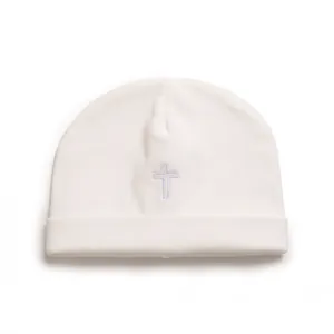 Minimalist soft white cotton knitted baby beanie hat featuring a delicate purple embroidered cross