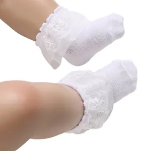 Delicate white cotton lace ruffle baby socks for newborn infants up to 12 months old
