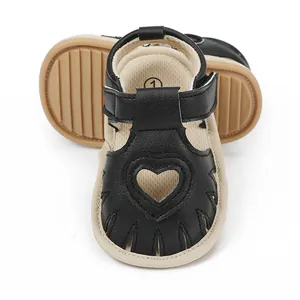 Detailed view of baby summer walking sandals with heart cutout and soft non-slip sole design
