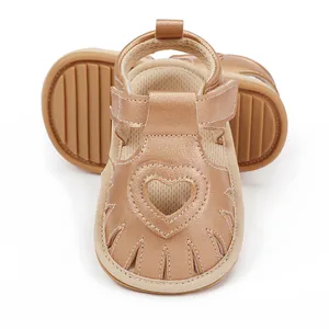 Stylish rose gold baby sandals with heart cutout and flexible rubber sole for toddlers