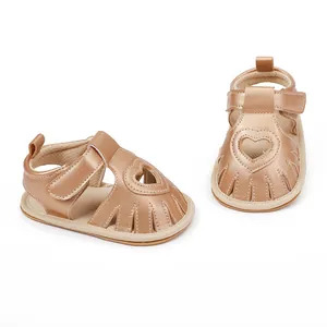 Detailed view of rose gold baby summer sandals featuring a stylish heart-shaped cutout design.
