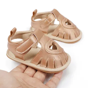 Detailed view of rose gold baby summer sandals featuring a heart cutout and Velcro strap