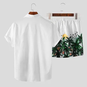 Detail view showing back of white short-sleeve shirt and printed tropical beach shorts set