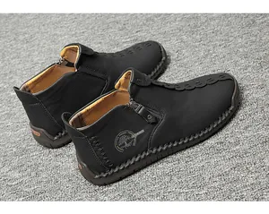 Detailed side view of handmade black men's high-top leather shoes with side zipper closure