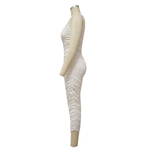Detailed side view of a white sleeveless ruched bodycon maxi dress on a dress form