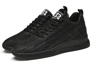 Detailed side profile of black breathable fly-knit men's running shoes with mesh