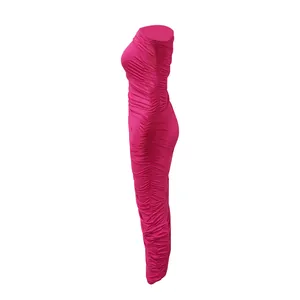 Side view detail of a vibrant fuchsia ruched bodycon dress with elegant draping.