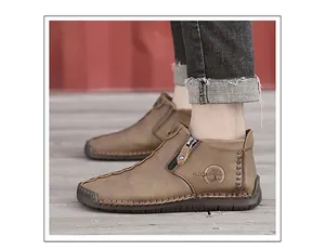 Close-up side view of men's brown leather high-top shoes with hand-stitched details