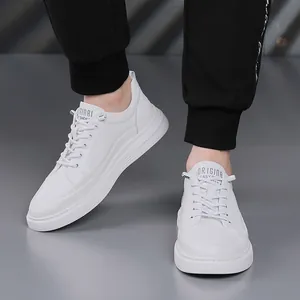 Versatile men's trendy casual white sneakers in a clean minimalist studio presentation