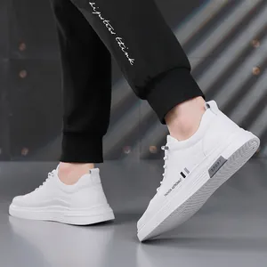 Men's trendy white sneakers featuring a casual slip-on design and fashion elements