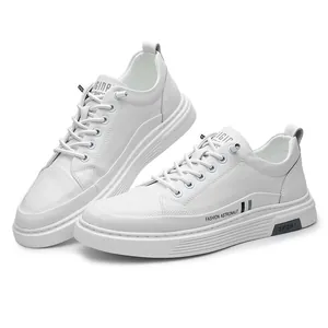 Fashionable men's white casual sneakers with minimalist design and lace-up closure