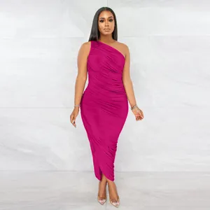 Detailed view of an elegant magenta one-shoulder ruched bodycon dress on a model