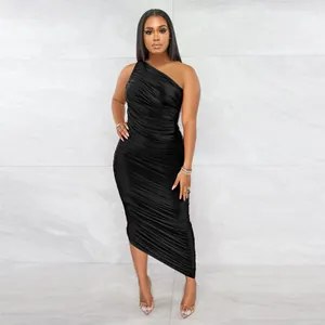 Full-length view of an elegant black one-shoulder ruched bodycon midi dress for party