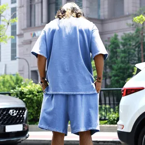 Vue arrière d'un ensemble de sport bleu pour hommes en tissu éponge coupe décontractée