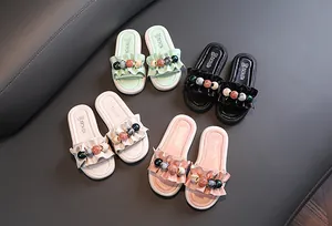 Selection of girl's ruffled slippers with colorful bead accents in four colors