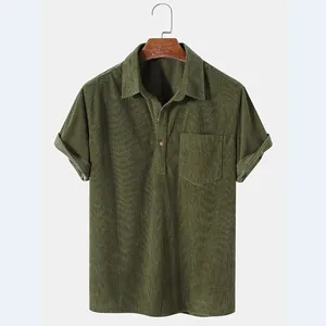 Detailed view of army green men's corduroy short-sleeved shirt with texture