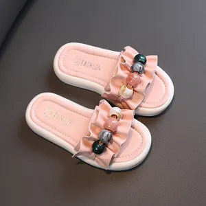 Stylish pink girl's slides featuring ruffles and colorful marble beads for summer
