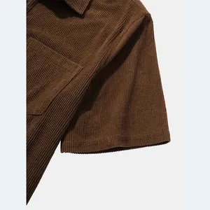 Detailed close-up showing the soft brown corduroy fabric texture of a men's casual shirt.
