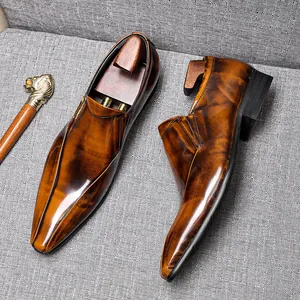 Elegant burnished brown leather loafers for men, glossy finish business casual shoes.