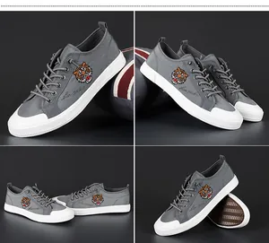 Vues détaillées sous quatre angles de baskets en toile grise avec broderie tigre.