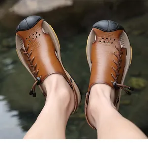 Close-up of brown leather men's dual-use outdoor beach sandals with elastic laces