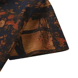 Close-up of men's vintage floral short sleeve shirt featuring intricate ethnic patterns.