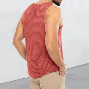 Back view detail of a men's coral knitted tank top with breathable mesh texture