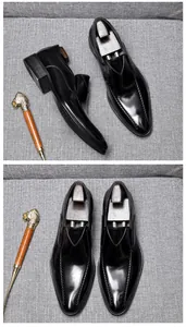 Close-up of black leather loafers showing the pointed toe and elegant stitching details.