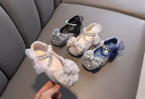 Sparkling glitter girls princess dress shoes featuring pearl straps and delicate mesh bows