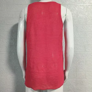 Back view of pink knitted men's sleeveless vest showing detailed texture and loose fit