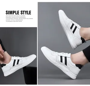 Detail view of men's white leather elevator sneakers with stylish black side stripes