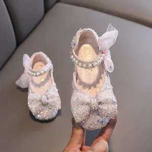 Elegant pink sequined girl's princess shoes featuring pearl straps and decorative mesh bows