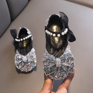 Elegant silver sparkly girls Mary Jane shoes with pearl strap and bow detail for party