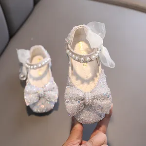 Elegant sparkling girls princess shoes with pearl straps and bow details for dance