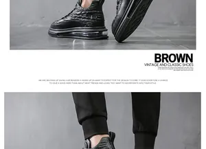 Detailed view of black high-top men's genuine leather shoes with visible air cushion sole