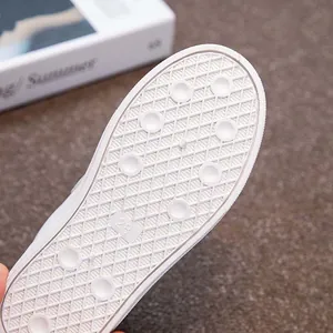 Detailed view of durable anti-slip white rubber sole for kids student sneakers size 28