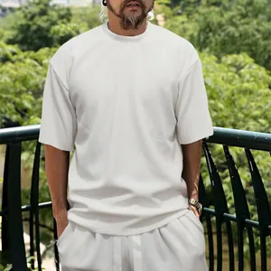 Detailed view of men's white vertical ribbed summer casual set with loose short sleeve tee