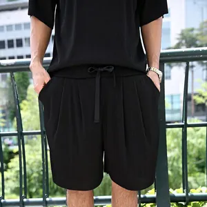 Detail view of the pleated texture on black vertical striped men's casual short set.