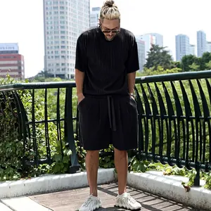 Men's summer pleated two-piece set featuring vertical striped short sleeve shirt and shorts