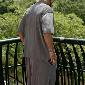 Detailed back view showing the vertical pleated texture of the grey men's summer casual set