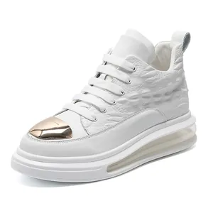 White high-top leather sneaker for men featuring gold toe cap and visible air cushion sole.