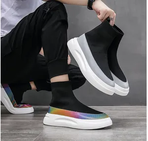 Detail view of men's high-top knit sock shoes with rainbow iridescent trim and white thick sole