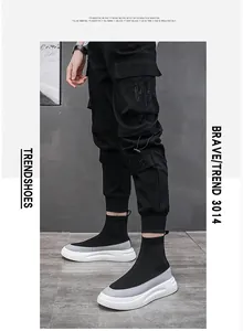 Side view detail of men's high-top breathable knit sock sneakers in black and gray