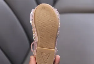 Close-up detail of anti-slip rubber sole for pink glittery girls' princess shoes