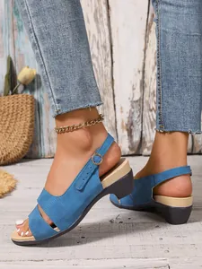Close-up detail of stylish blue peep-toe wedge sandals featuring an adjustable buckle ankle strap